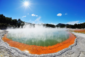 Champagnerpool with sun, Wai-O-Tapu Thermal Wonderland, Bay of Plenty, North Island, New Zealand Champagnerpool with sun, Wai-O-Tapu Thermal Wonderland, Bay of Plenty, North Island, New Zealand